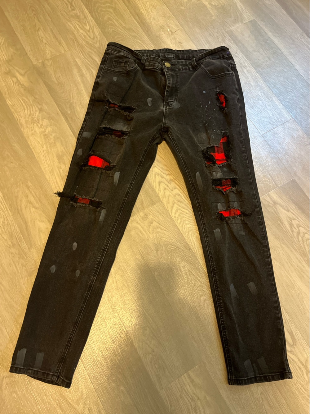 Men Black Distressed Jeans with Red Plaid Underlay